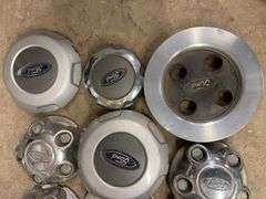 Tote of Ford hub caps and parts