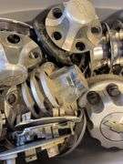 Large tote of Chevy hub caps and parts