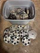 Tote of Chevy hub caps and parts