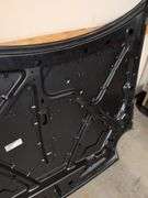 Unmarked black vehicle hood - see photos