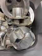 Tote of Ford hub caps and parts