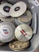 Tote of Buick hub caps and parts