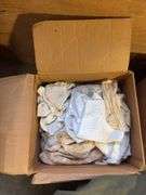 Boxes of rags, military bag, and blankets