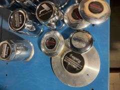 Box of American racing hubcap covers