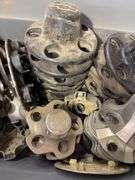 Tote of Chevy hub caps and parts