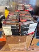 (2) shelves of vehicle-related items - sparkplugs, signs, and more