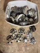 Tote of Chevy hub caps and parts