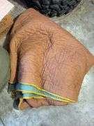 Boxes of rags, military bag, and blankets