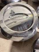 Box of Ford and Ruff racing hub caps