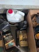 Assortment of mechanic fluids and some tools