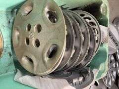 Large tote of Nissan hub caps and parts