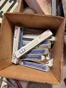 Large assortment of car parts, office supplies, and miscellaneous