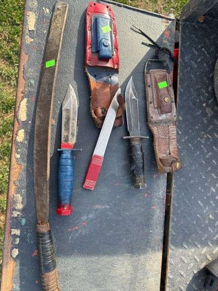 Assorted knives and Machete and sheaths