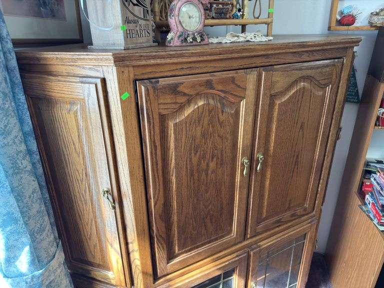 Corner Entertainment Center has cracked glass pane