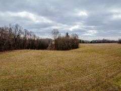 25.6 +/- Acres Farm land and woods. Great Building sites