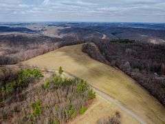 27.9 +/- Acres Farm land and woods. Great Building sites