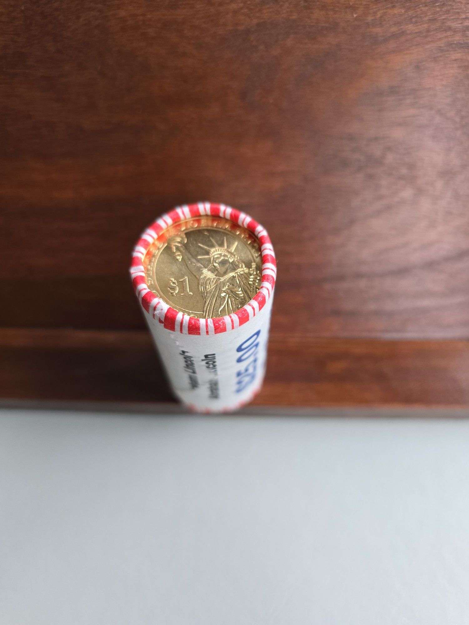 ROLL OF 25 ABRAHAM LINCOLN DOLLARS IN BANK ROLL BU