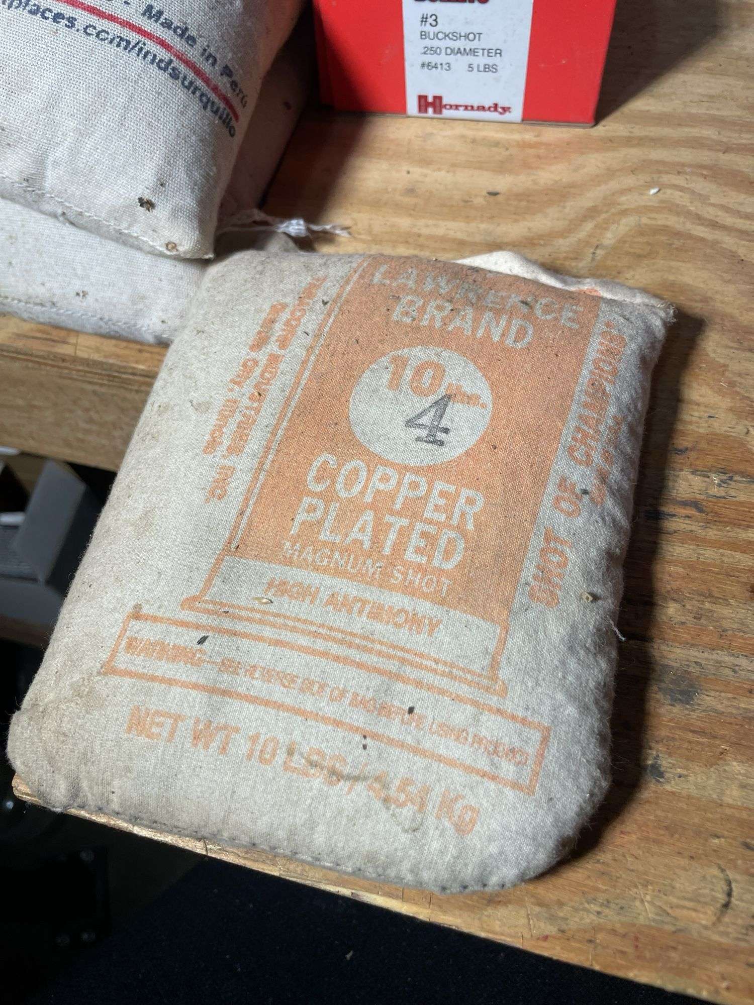 (4) bags of lead shot, small bag of copper plated #4 shot and #3 buckshot