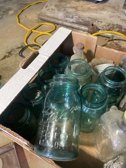Box of Antique bottles including blue Ball jars, mini bottles, jugs, graters and more