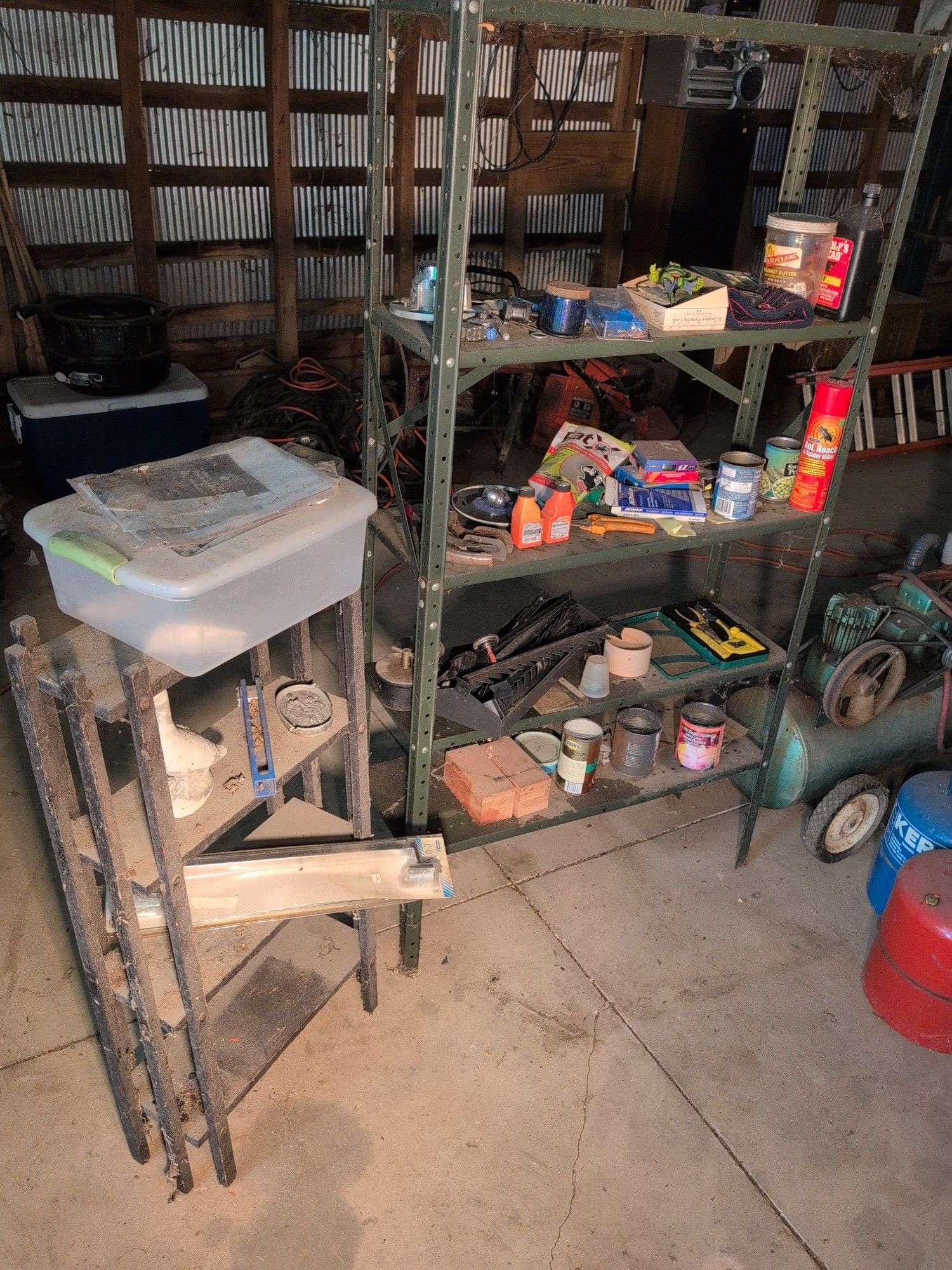 Metal shelving and wooden shelving - both with contents