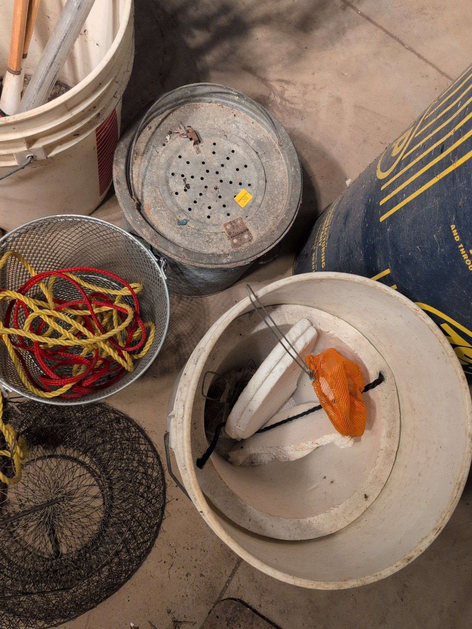 Large assortment of fishing supplies - nets, minnow traps, and more