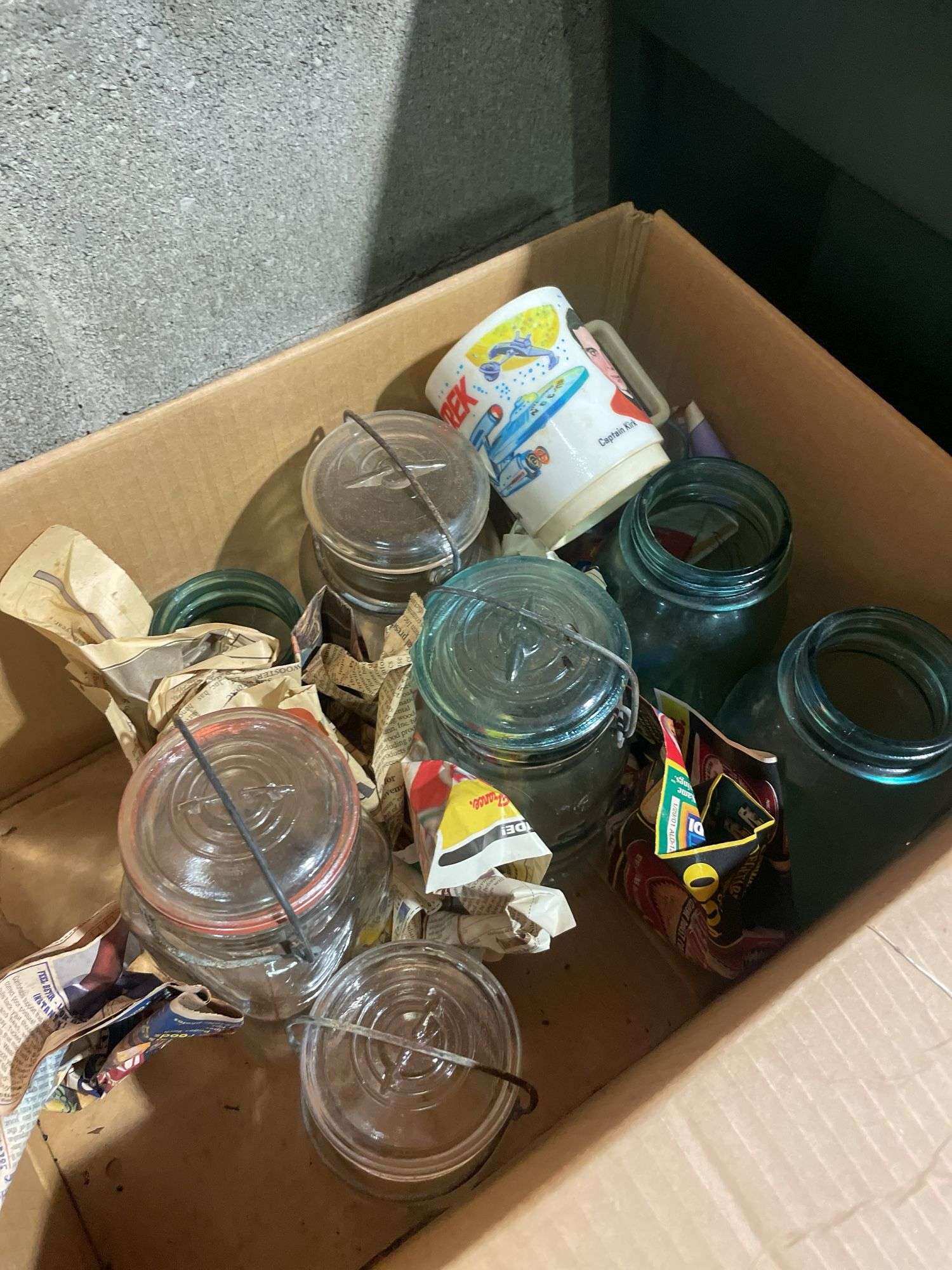 Box of jars including clear and blue - mostly Atlas