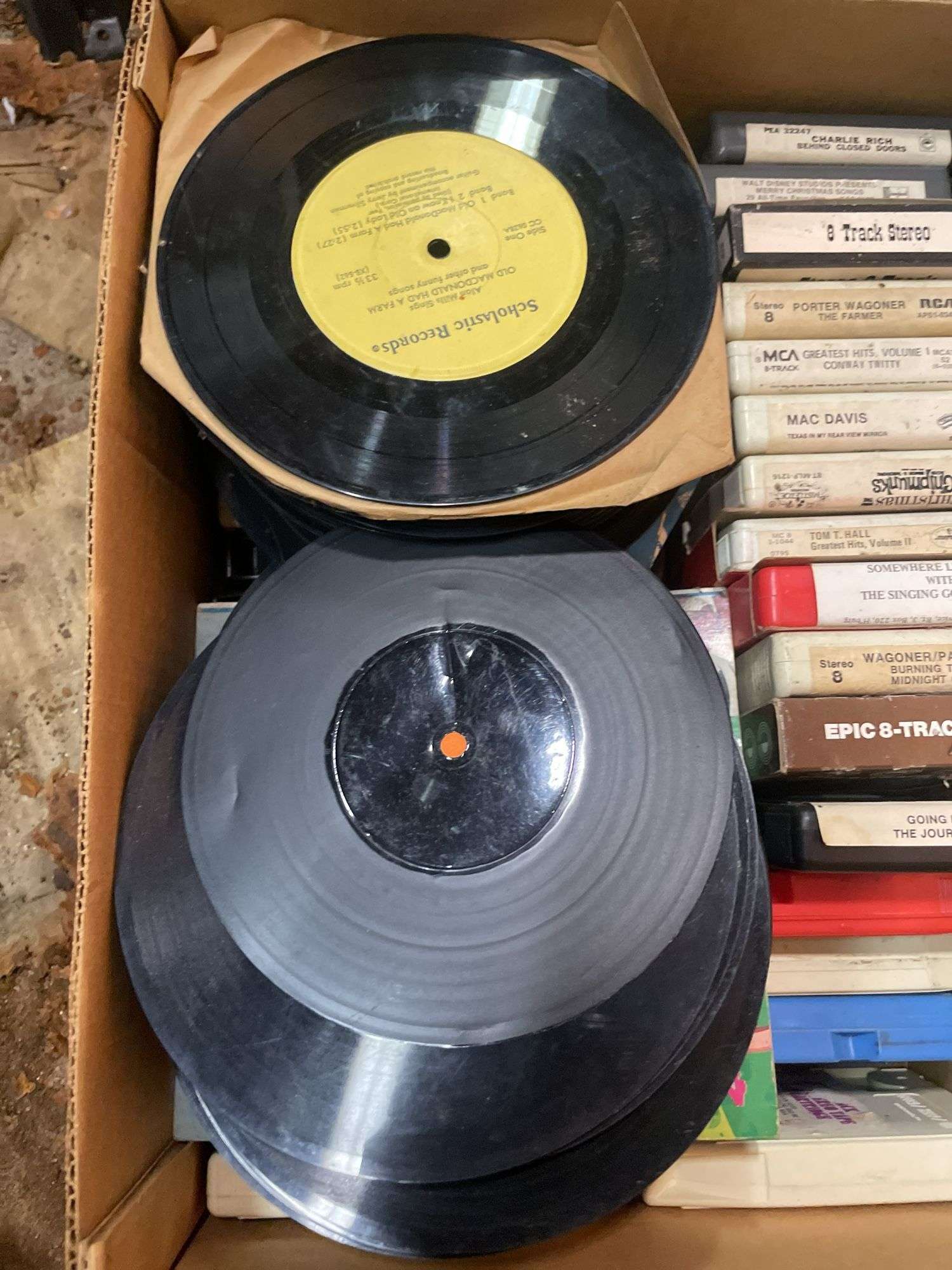 (2) boxes of 8 tracks and (2) boxes of records