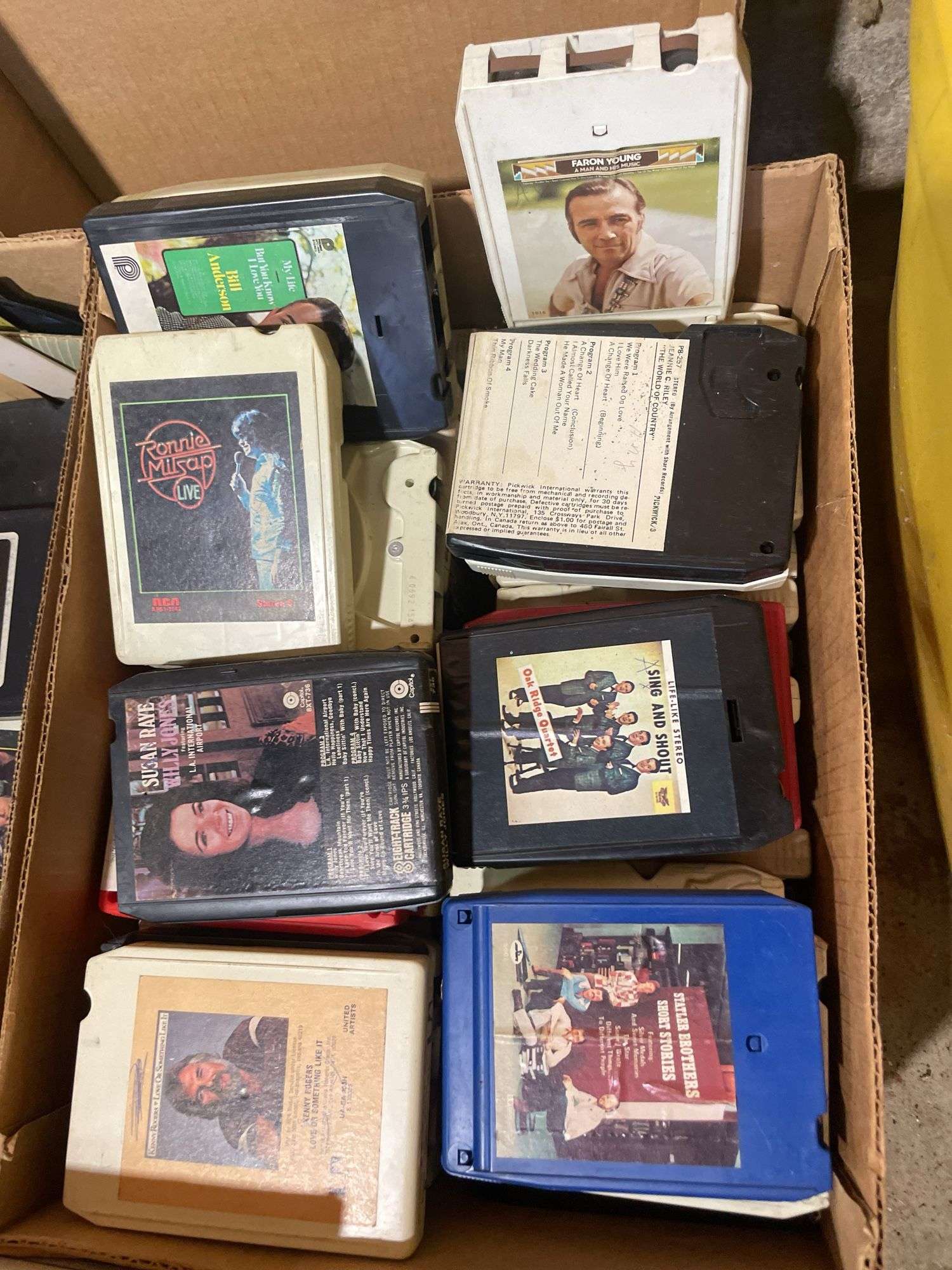 (2) boxes of 8 tracks and (2) boxes of records