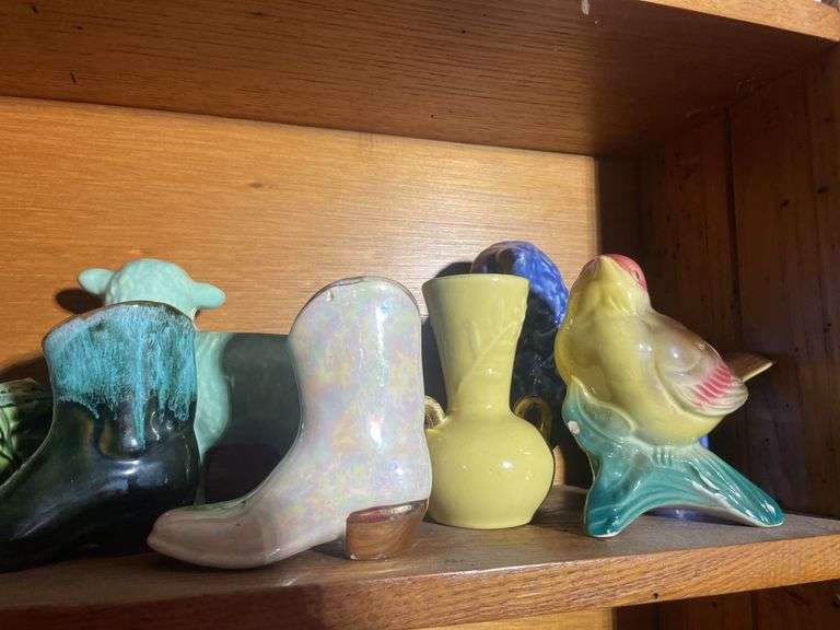 Contents of shelving including decorative Christmas buildings, ceramic planters, figurines & decor