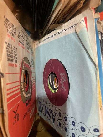 (2) boxes of 8 tracks and (2) boxes of records