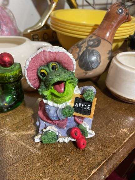 Box of decorative items including rooster clock, butterfly wall hanger, soap dispenser, kitchen item