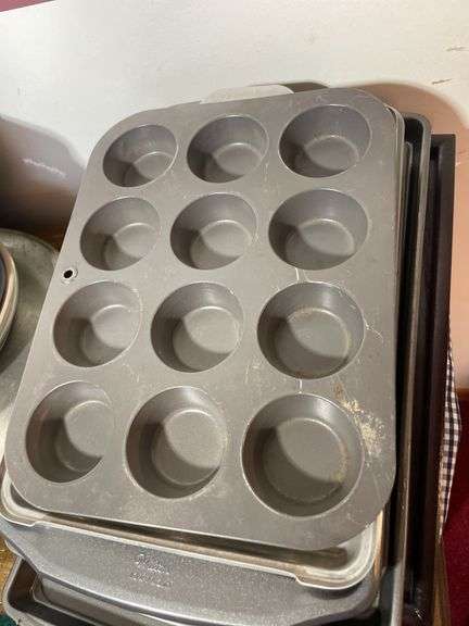 Large lot of frying pans, pizza pans, rolling pin, cake & cupcake pans & misc.