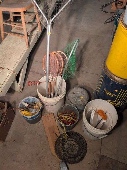 Large assortment of fishing supplies - nets, minnow traps, and more