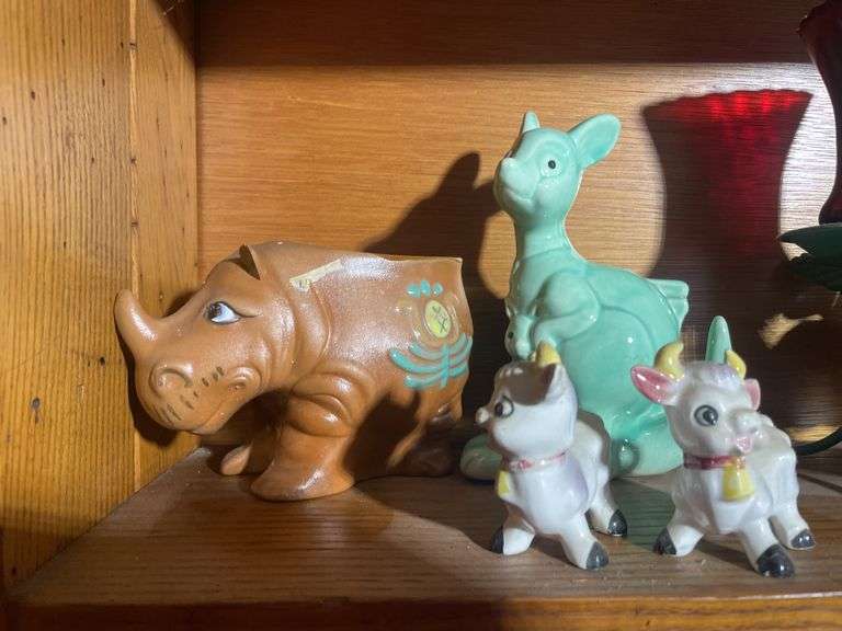 Contents of shelving including decorative Christmas buildings, ceramic planters, figurines & decor