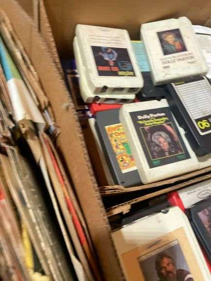 (2) boxes of 8 tracks and (2) boxes of records