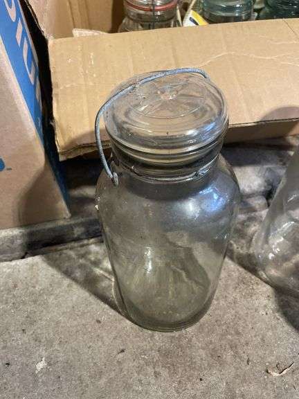 Box of jars including clear and blue - mostly Atlas