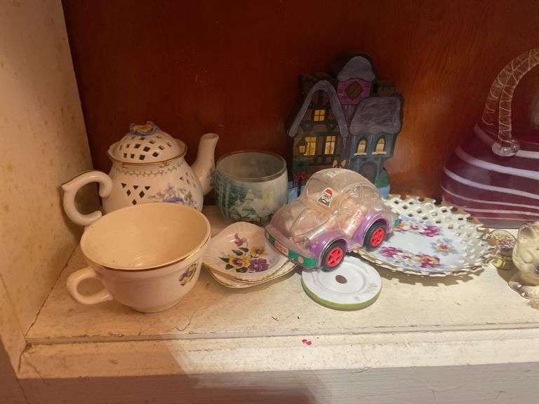 Contents of 3 shelves including decorative glassware- pitchers, bowl, basket, figurines & more