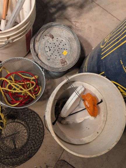 Large assortment of fishing supplies - nets, minnow traps, and more