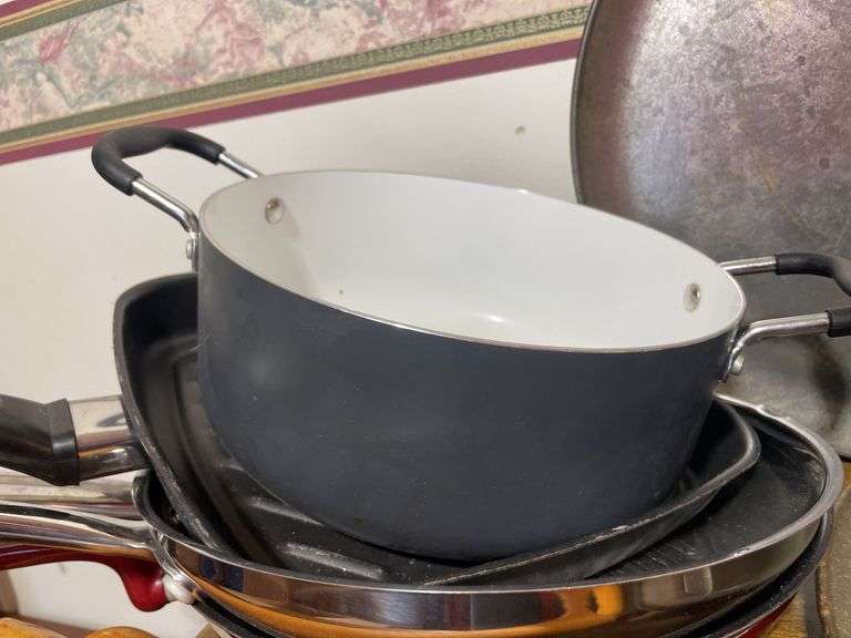 Large lot of frying pans, pizza pans, rolling pin, cake & cupcake pans & misc.