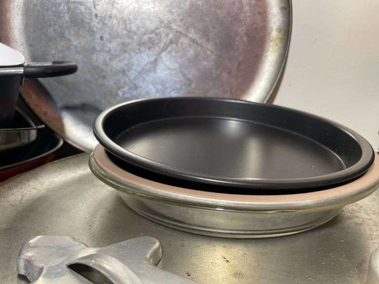 Large lot of frying pans, pizza pans, rolling pin, cake & cupcake pans & misc.