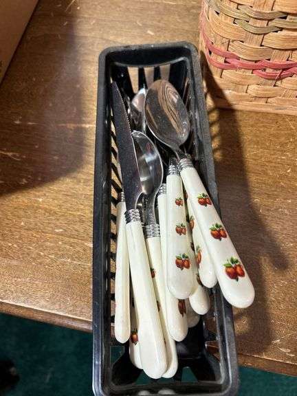 Basket with kitchen gadgets/kitchen utensils including spoons, scissors, spoons forks and more