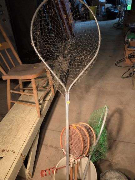 Large assortment of fishing supplies - nets, minnow traps, and more