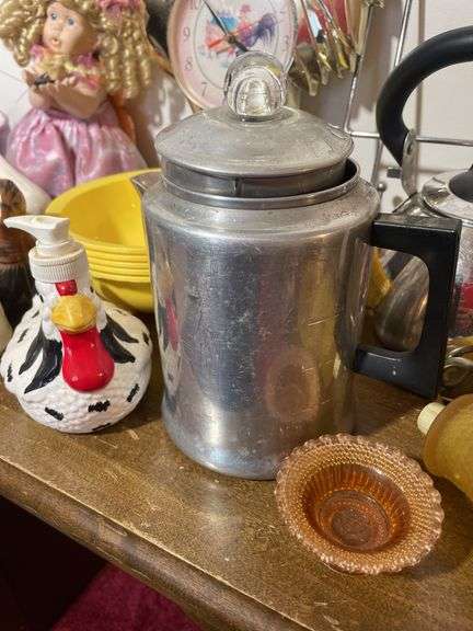 Box of decorative items including rooster clock, butterfly wall hanger, soap dispenser, kitchen item