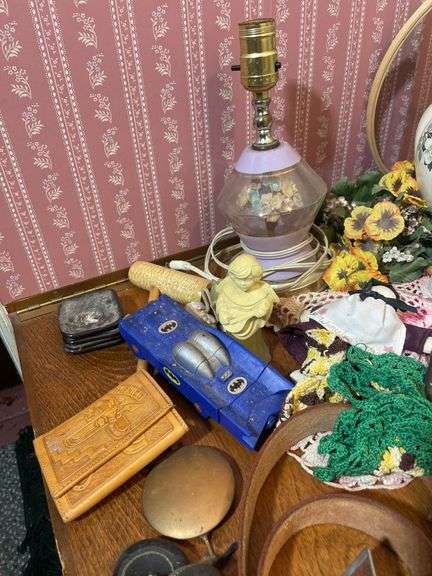 Large lot of glassware & household decor including pitcher, drinking glasses, old baby shoes and mor