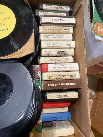 (2) boxes of 8 tracks and (2) boxes of records