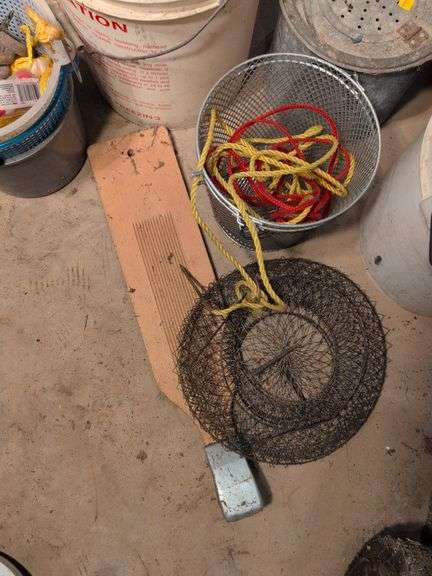 Large assortment of fishing supplies - nets, minnow traps, and more