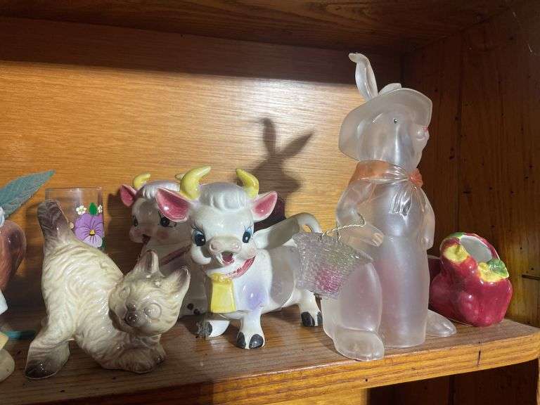 Contents of shelving including decorative Christmas buildings, ceramic planters, figurines & decor