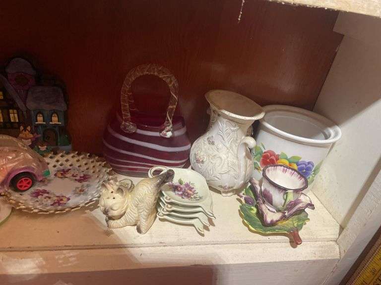 Contents of 3 shelves including decorative glassware- pitchers, bowl, basket, figurines & more