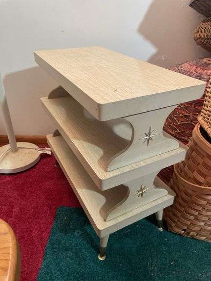 Wooden chair on wheels, small stand and floor lamp