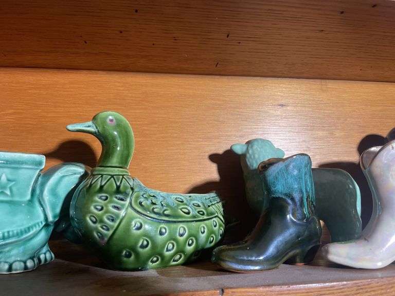 Contents of shelving including decorative Christmas buildings, ceramic planters, figurines & decor